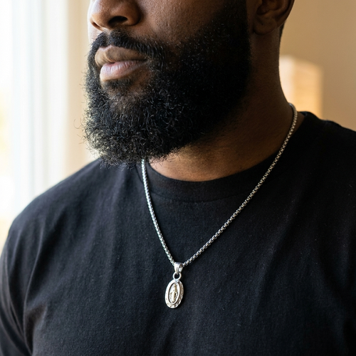 Man wearing the Catholic medal pendant necklace on a curb chain