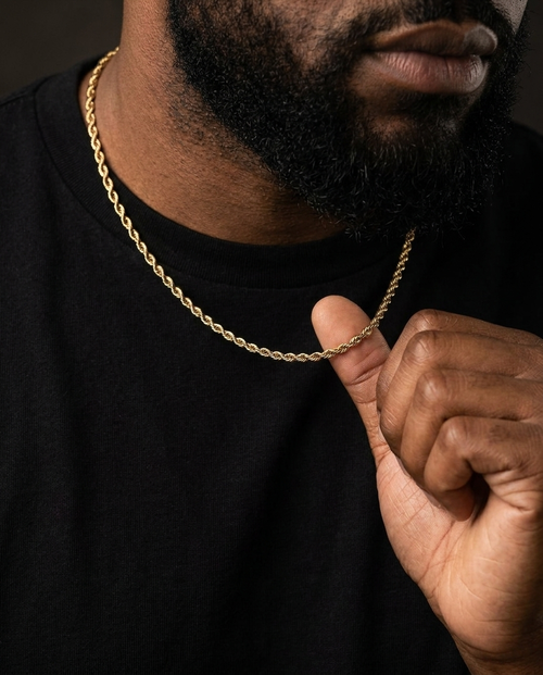 Man wearing a gold rope chain with a black T-shirt