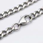 Close-up of the lobster clasp on the silver Cuban link chain