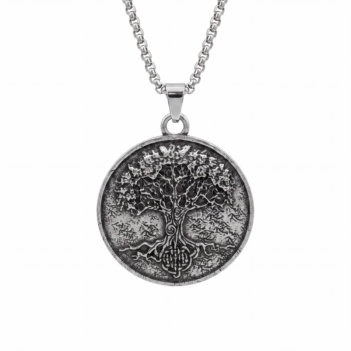 Oxidised silver Tree of Life pendant necklace on a white background