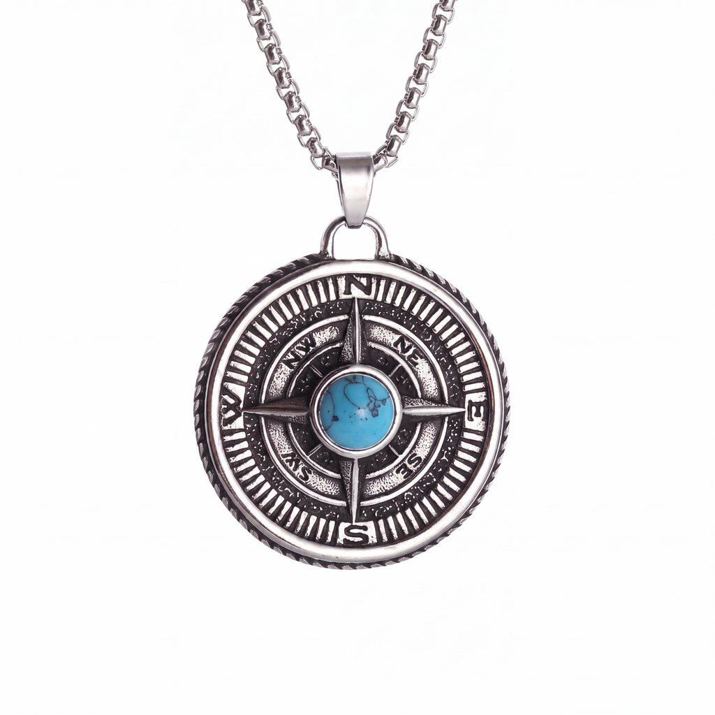 Turquoise compass pendant necklace in silver on a white background