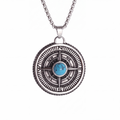 Turquoise compass pendant necklace in silver on a white background