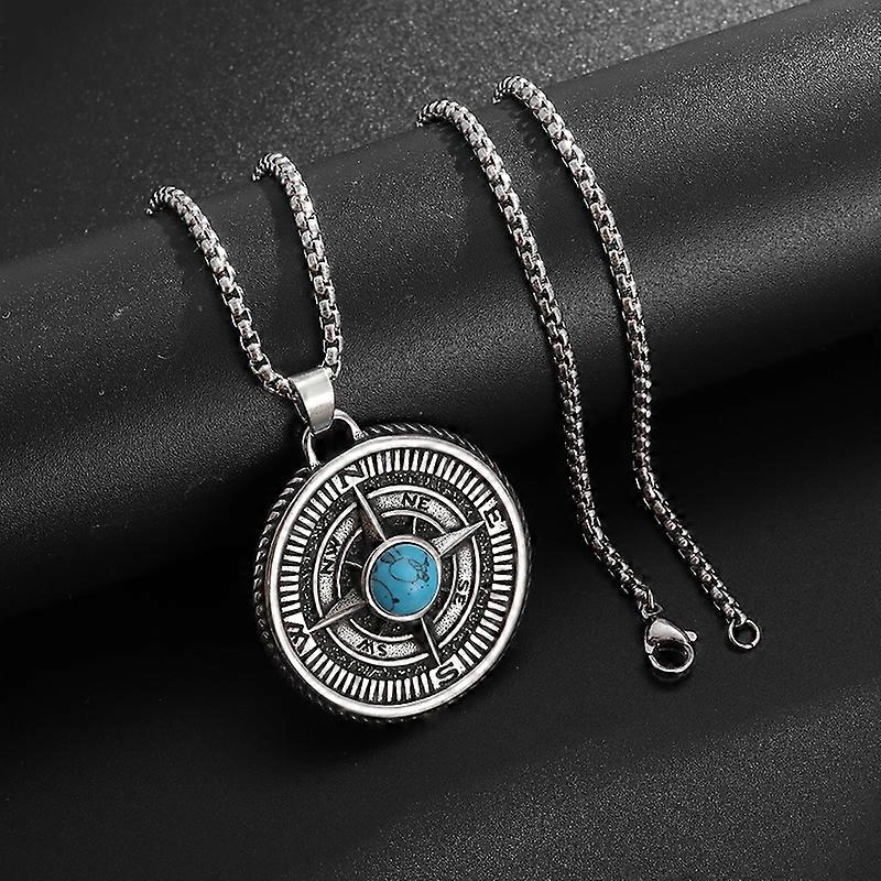 Close-up of the turquoise stone and etched compass markings