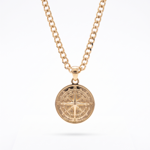 Gold compass pendant necklace on a curb-link chain