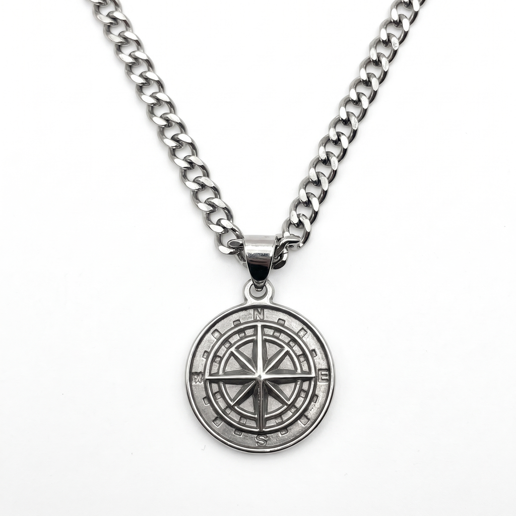 Silver compass pendant necklace on a curb-link chain
