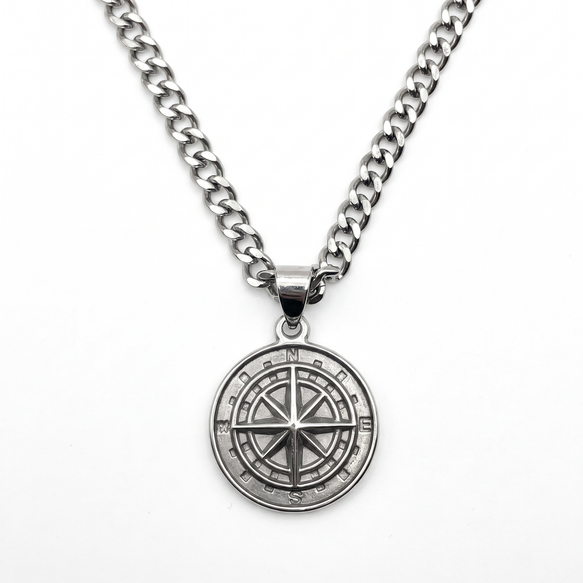 Silver compass pendant necklace on a curb-link chain
